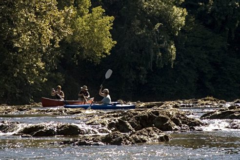 Paddlers navigate rapids on the Rivanna River.