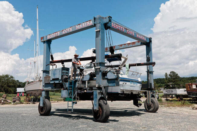 Boat is being worked on on the land.