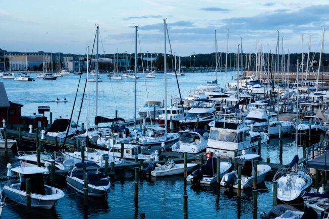 Several boats sit in the harbor.