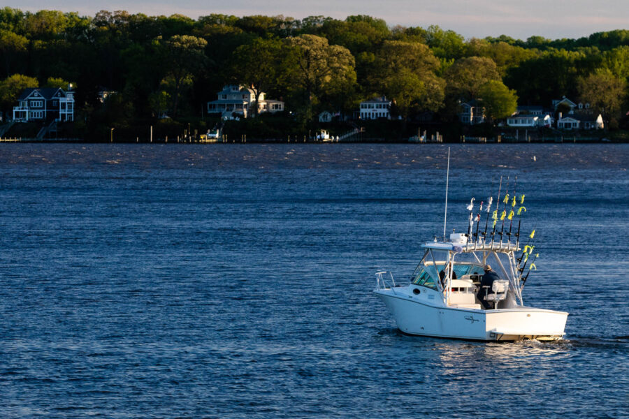A boat glides down the river.