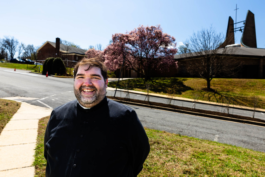 Rev. Francisco E. Aguirre smiles in front of the church he leads.