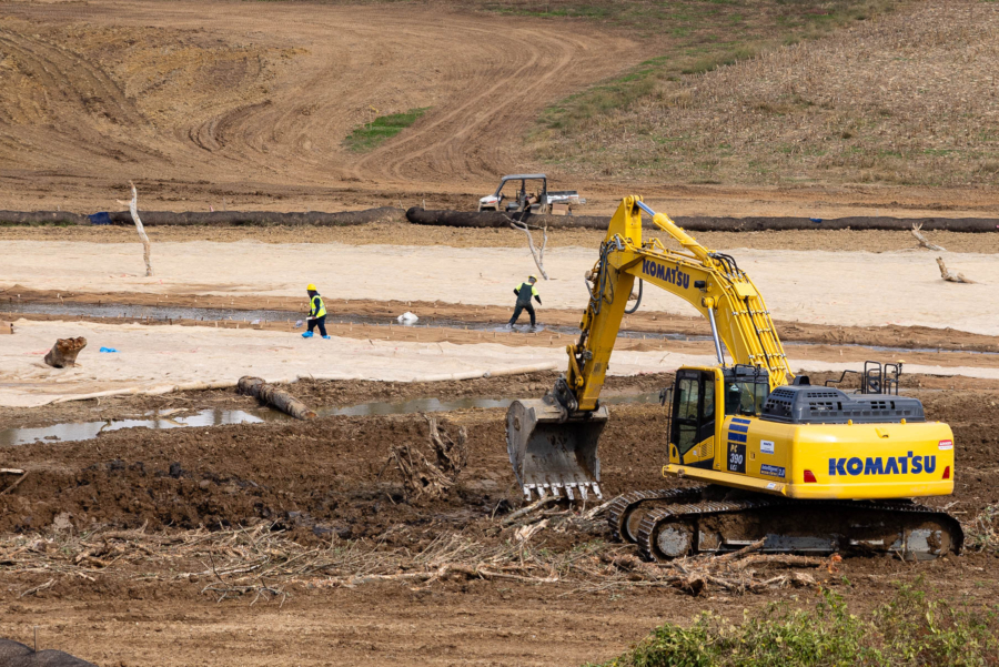 A restoration site cleared by a backhoe is devoid of greenery that will eventually inhabit the stream.