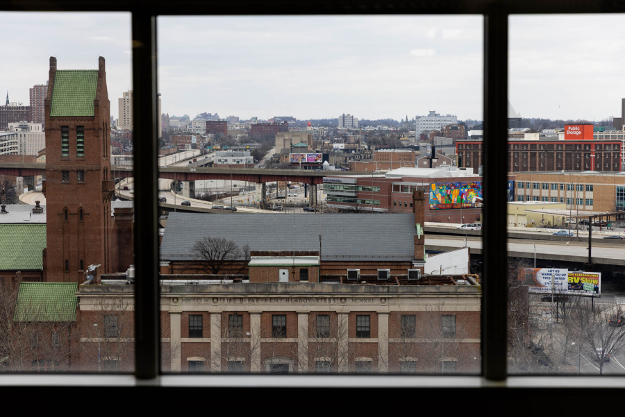 Buildings and highway on a cloudy day.