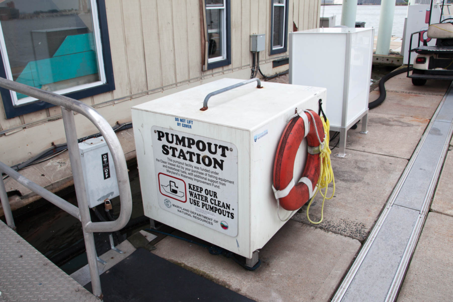 A big white box marked "Pumpout Station" sits at a marina.