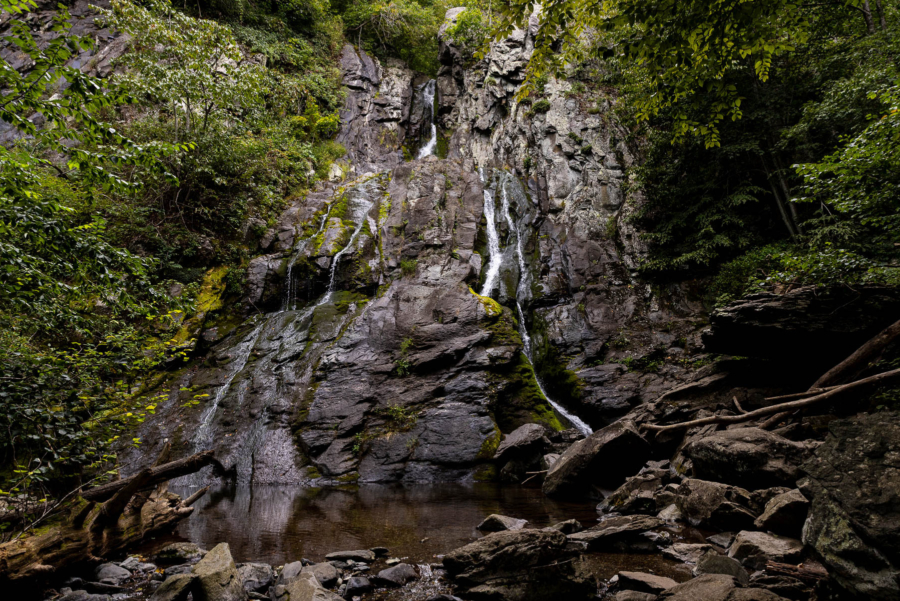 Thin waterfall cascading down a steep cliff.