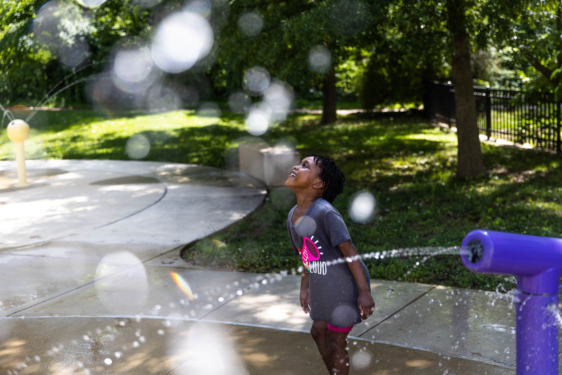 Little girl plays in the water at Marvin Gaye Park.