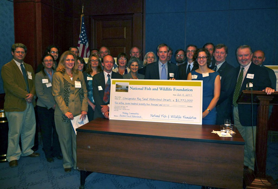 Grant recipients with big check